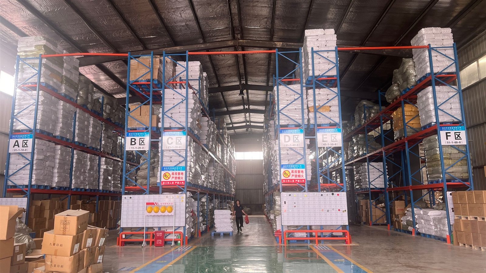 Organized storage area at a Yubai Glass partner factory prepared for order handling