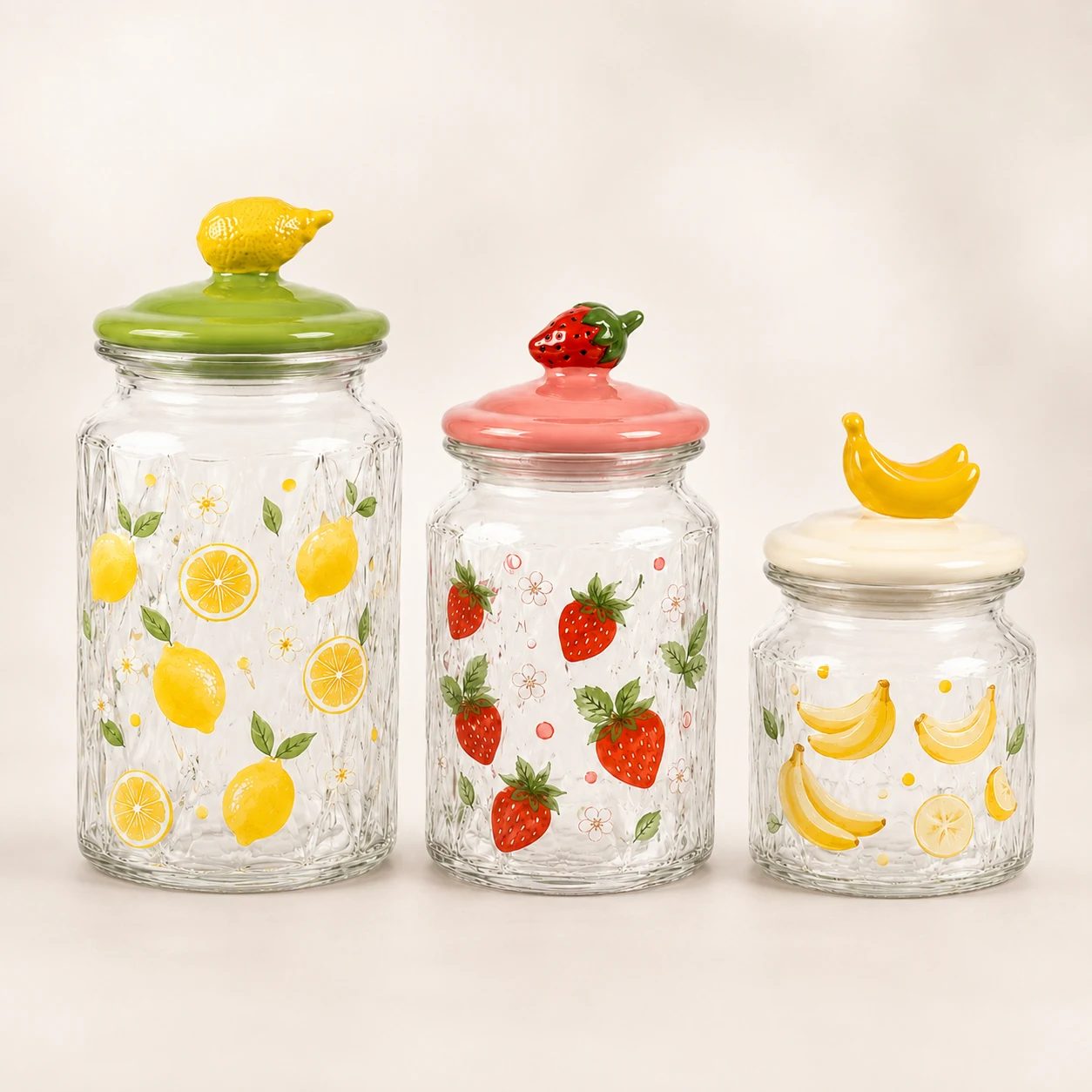 Three fruit lid Easter glass storage jars with lemon strawberry and banana designs