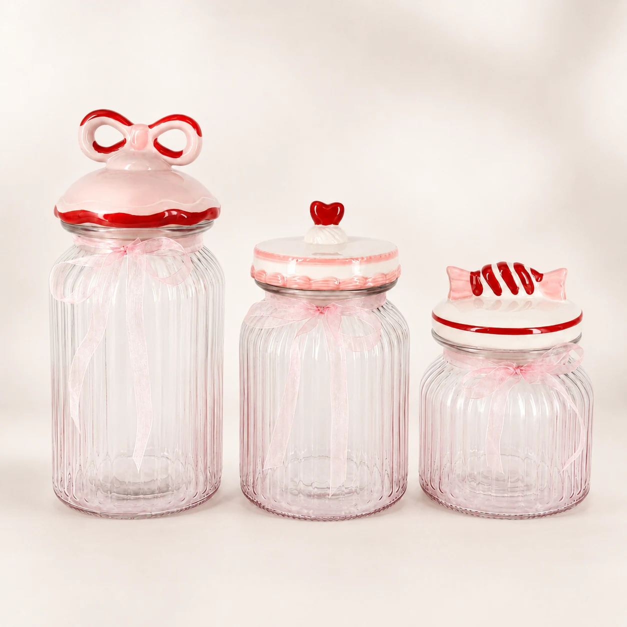 Three pink bow Valentine glass storage jars